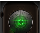 Back of Apple Watch Series 12, aluminium case, dark bronze colour, multiple round sensors with glowing green LED lights, left side exterior, Digital Crown, Sport Band, olive colour